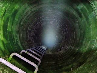 Illustration for article titled Unreal photographs of tunnels look like portals into the underworld